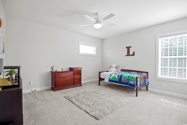 bedroom with light carpet and ceiling fan