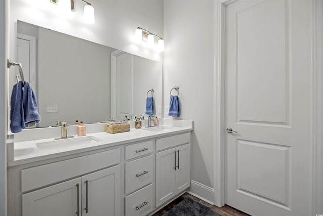 bathroom featuring vanity and wood-type flooring