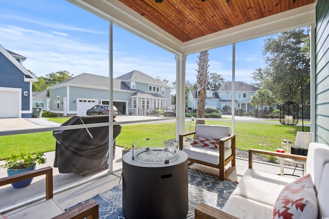 sunroom featuring wood ceiling