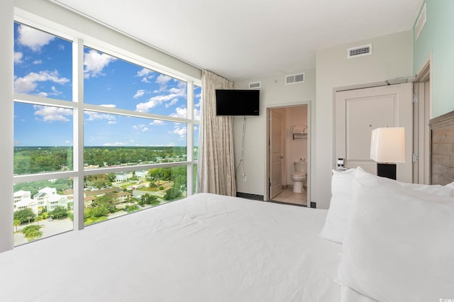 bedroom featuring ensuite bath