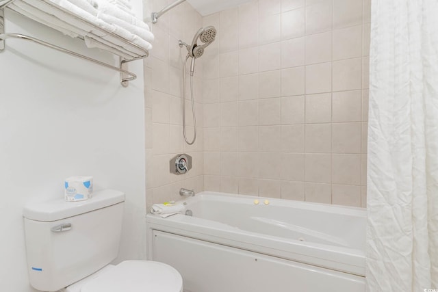 bathroom featuring shower / bath combo and toilet