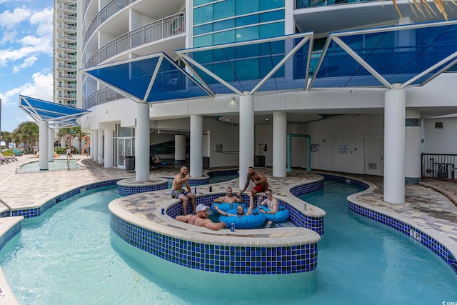 view of pool featuring a patio