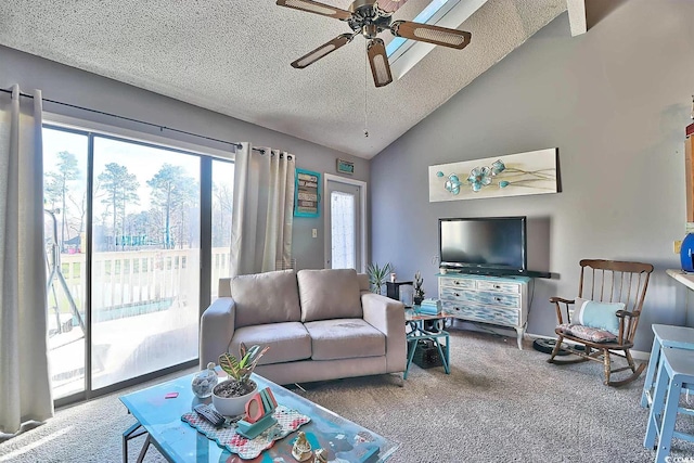 living room with ceiling fan, a textured ceiling, vaulted ceiling, and carpet