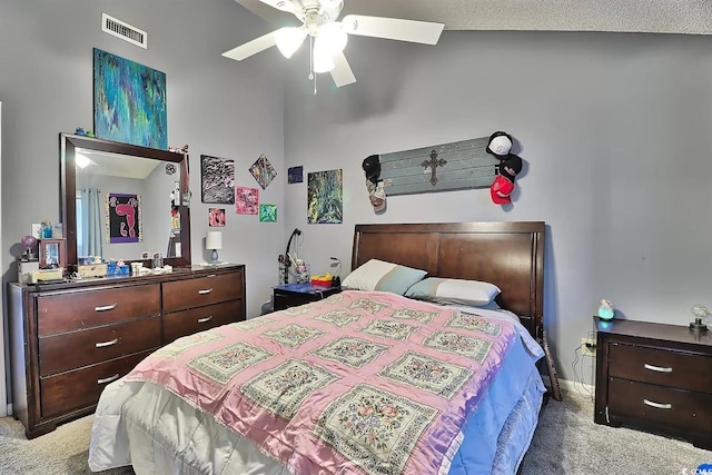 carpeted bedroom with ceiling fan, a textured ceiling, and lofted ceiling