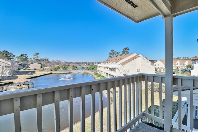 balcony featuring a water view