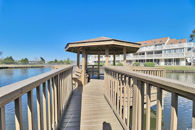 dock area featuring a gazebo and a water view