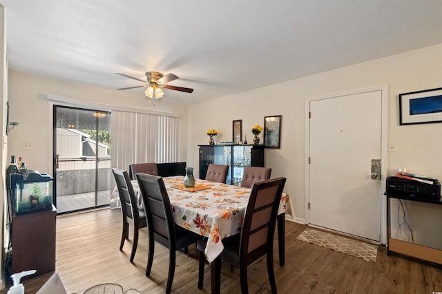 dining area featuring hardwood / wood-style floors and ceiling fan