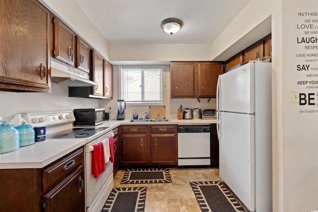 kitchen featuring white appliances and sink