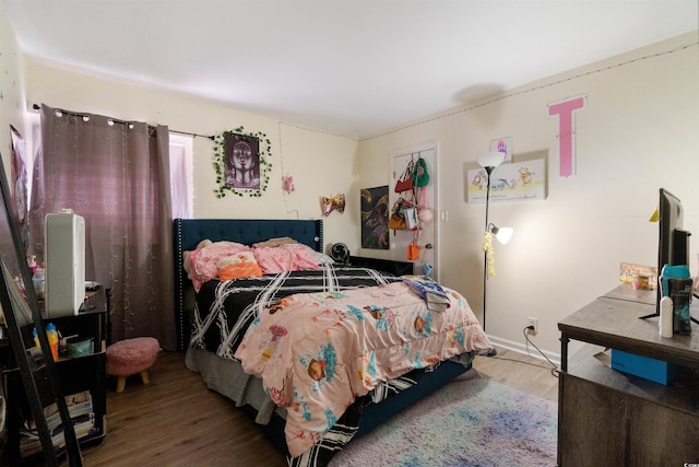 bedroom featuring hardwood / wood-style floors