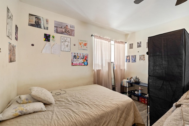 bedroom featuring ceiling fan and hardwood / wood-style floors