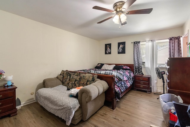 bedroom featuring light hardwood / wood-style floors and ceiling fan