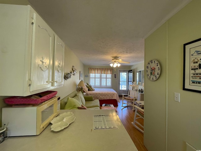 bedroom featuring wood-type flooring and a textured ceiling