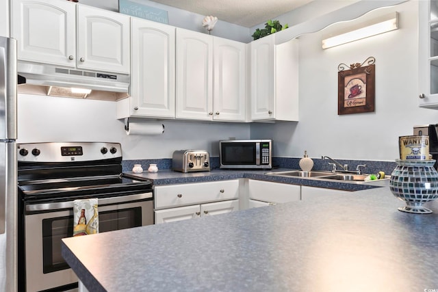 kitchen featuring stainless steel appliances, white cabinets, and sink