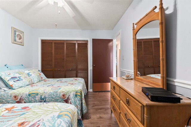 bedroom featuring ceiling fan and dark hardwood / wood-style flooring