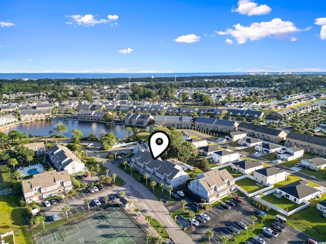 birds eye view of property featuring a water view