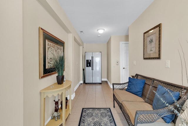 hallway with light tile patterned floors