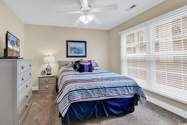 carpeted bedroom with ceiling fan