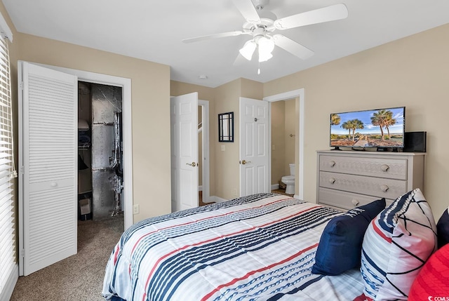 carpeted bedroom featuring ceiling fan, a closet, and ensuite bathroom