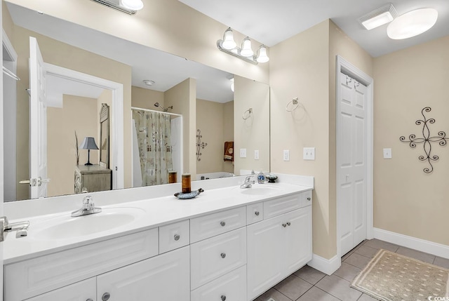 bathroom with vanity, a shower with shower curtain, and tile patterned floors