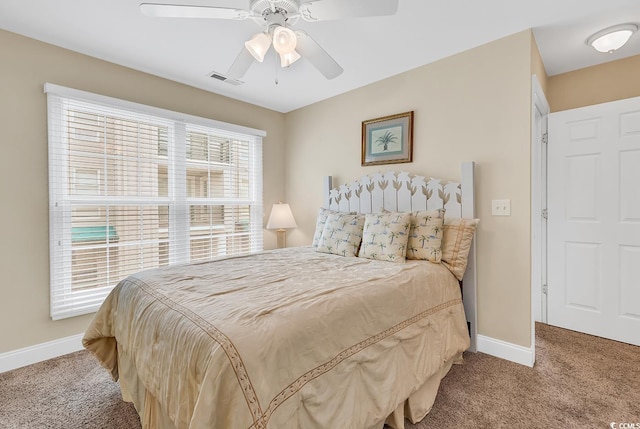 carpeted bedroom with ceiling fan