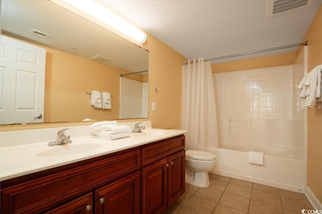 full bathroom with tile patterned floors, toilet, visible vents, and a sink