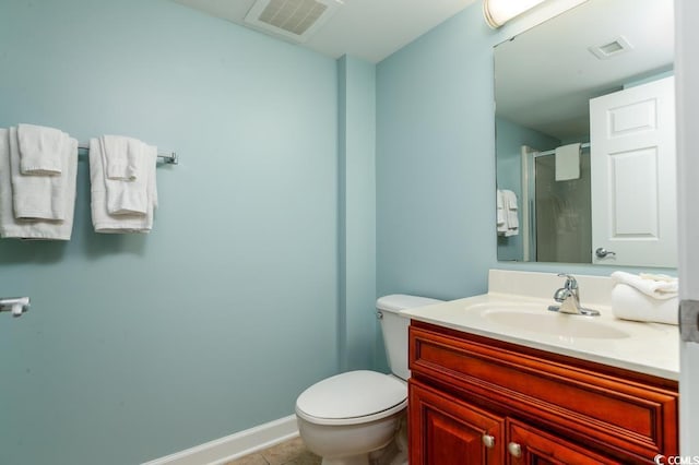 full bathroom featuring visible vents, toilet, a shower stall, tile patterned flooring, and vanity