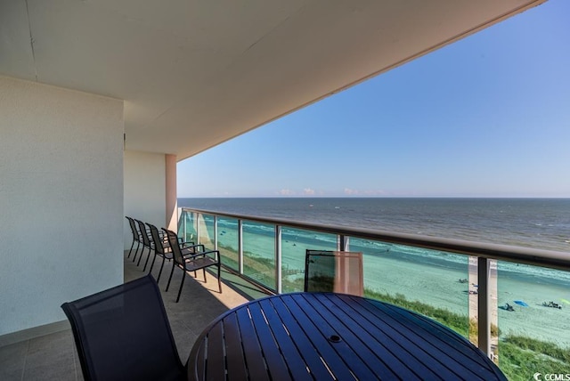 balcony with a beach view and a water view