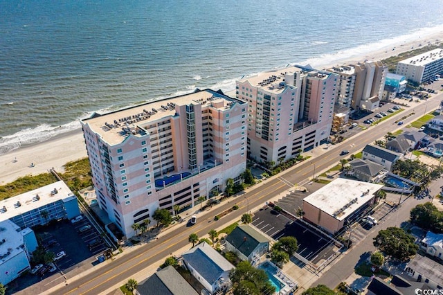 bird's eye view featuring a beach view and a water view