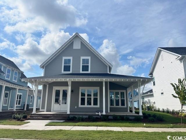 view of front of house featuring a front yard and a porch