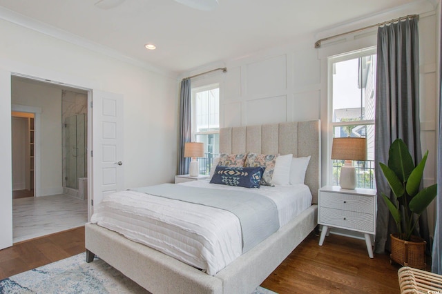 bedroom featuring multiple windows, crown molding, and dark hardwood / wood-style floors