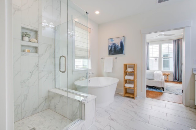 bathroom with shower with separate bathtub and hardwood / wood-style flooring