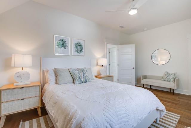 bedroom featuring vaulted ceiling, ceiling fan, and dark hardwood / wood-style floors