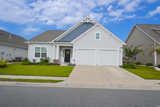 craftsman inspired home featuring central AC, a front yard, and a garage