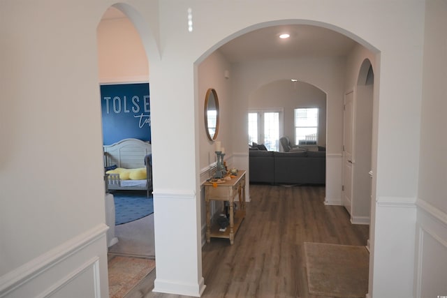 hallway with dark hardwood / wood-style flooring