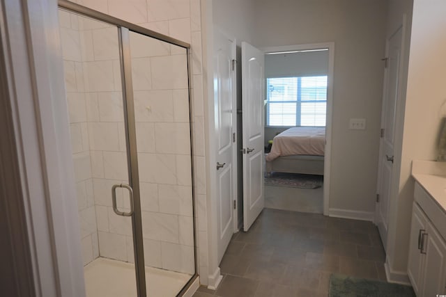 bathroom featuring vanity and a shower with door