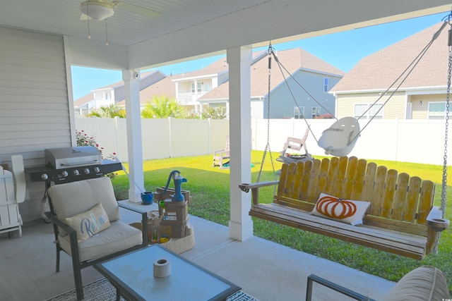 view of patio featuring ceiling fan