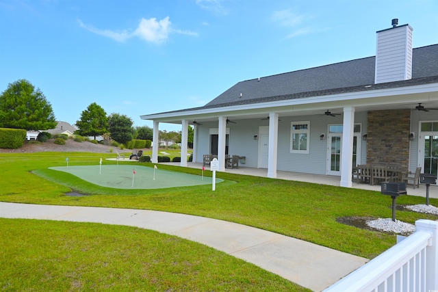 exterior space featuring a patio area and a lawn