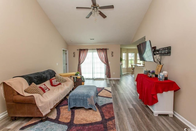 living room with high vaulted ceiling, ceiling fan, and hardwood / wood-style floors