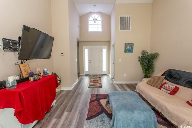 333 Carolina Springs Ct, Conway, SC 29527 - foyer entrance featuring baseboards, high vaulted ceiling, visible vents, and wood finished floors