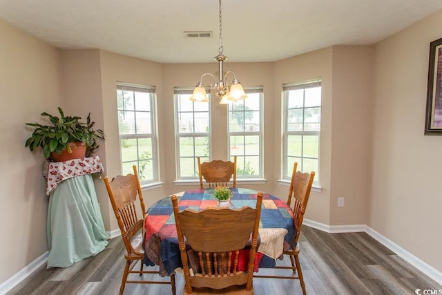 333 Carolina Springs Ct, Conway, SC 29527 - dining room featuring an inviting chandelier, a healthy amount of sunlight, and wood finished floors