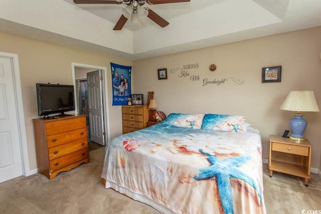 bedroom featuring light carpet and ceiling fan