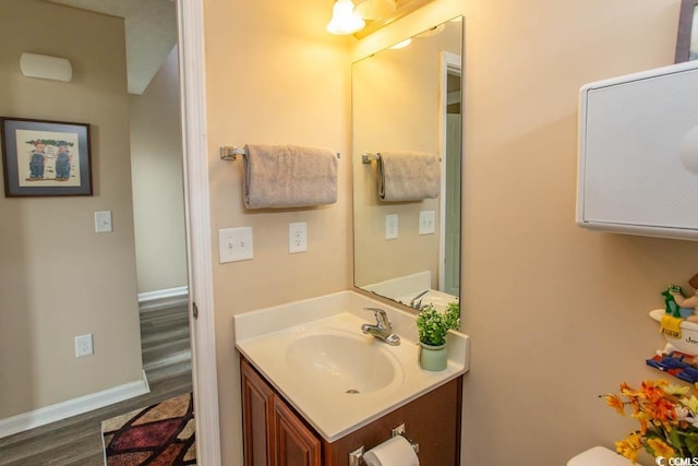 bathroom featuring wood-type flooring and vanity