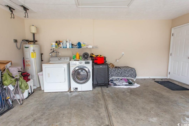 clothes washing area with water heater and separate washer and dryer