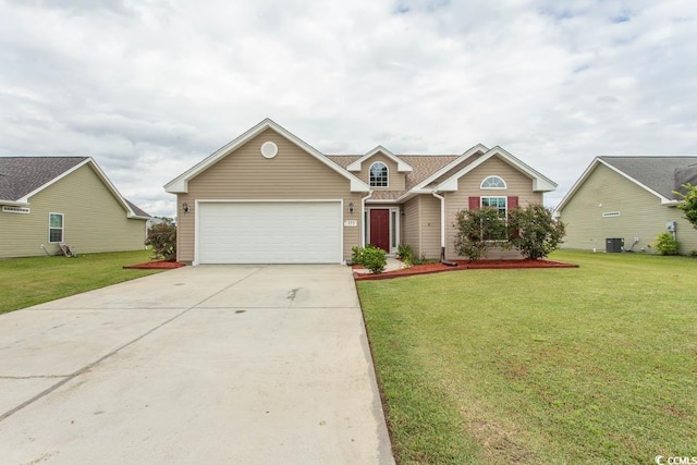 view of front of house with a front yard, a garage, and central AC