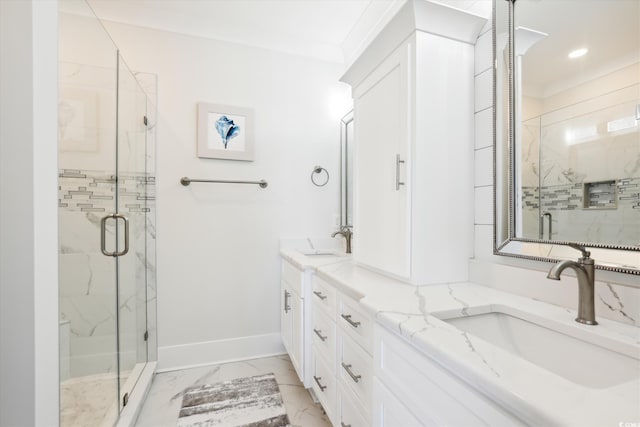 bathroom featuring baseboards, marble finish floor, a marble finish shower, and a sink