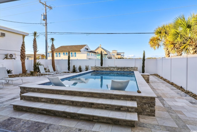 view of pool with a patio area, a fenced in pool, and a fenced backyard