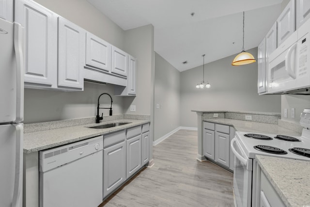 kitchen featuring pendant lighting, white appliances, light hardwood / wood-style flooring, sink, and white cabinets