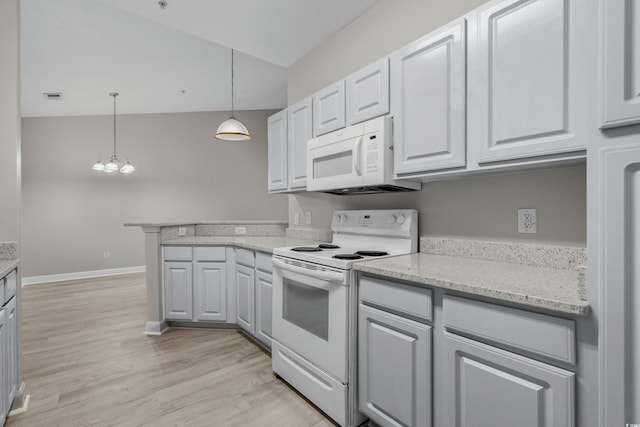 kitchen with white cabinets, white appliances, light hardwood / wood-style floors, hanging light fixtures, and vaulted ceiling