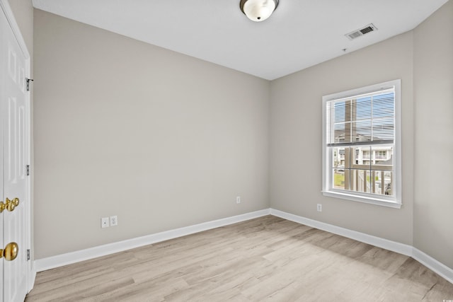 spare room featuring light wood-type flooring