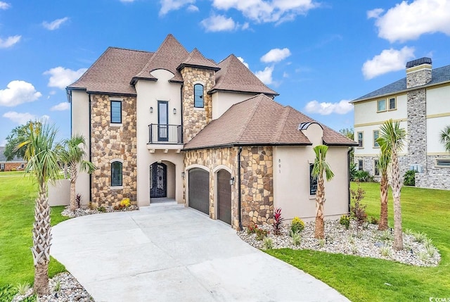 french country inspired facade with a balcony and a front yard